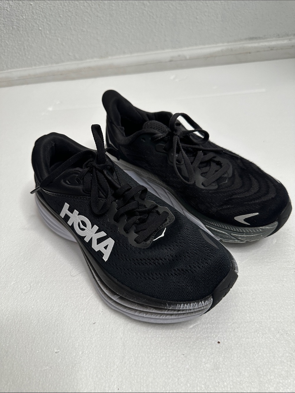Hoka Black Athletic Running Shoes with White Logo 2different pairs